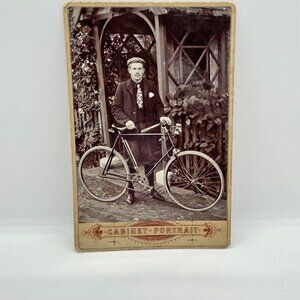 Antique Cabinet Card Photo Of Man With Bicycle in Sepia tones